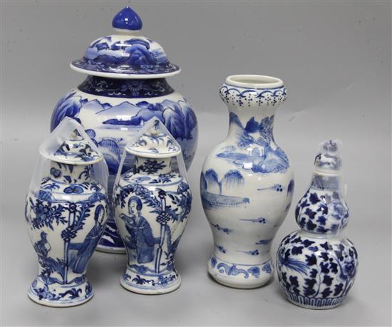 An Asian blue and white inverted pyriform jar and cover, a similar pair of smaller vases and two other items, H 25cm (largest)